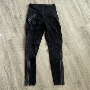 Athlete black leggings with leather accent! Size XS in used condition.